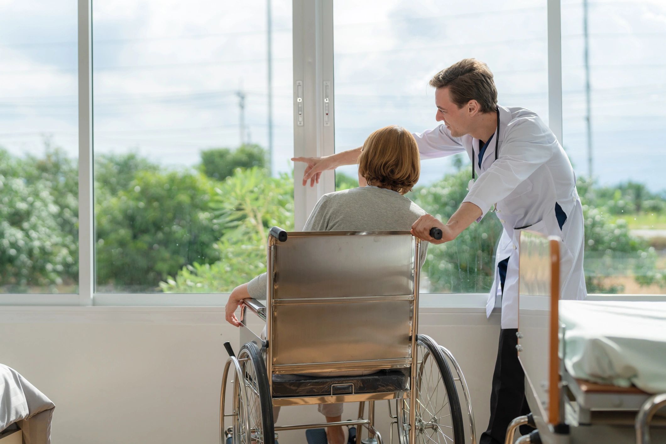 Care professional speaking with an older adult at home